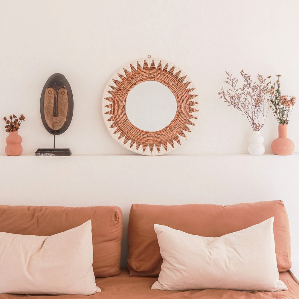 Round woven banana fibre wall mirror with white cotton pattern