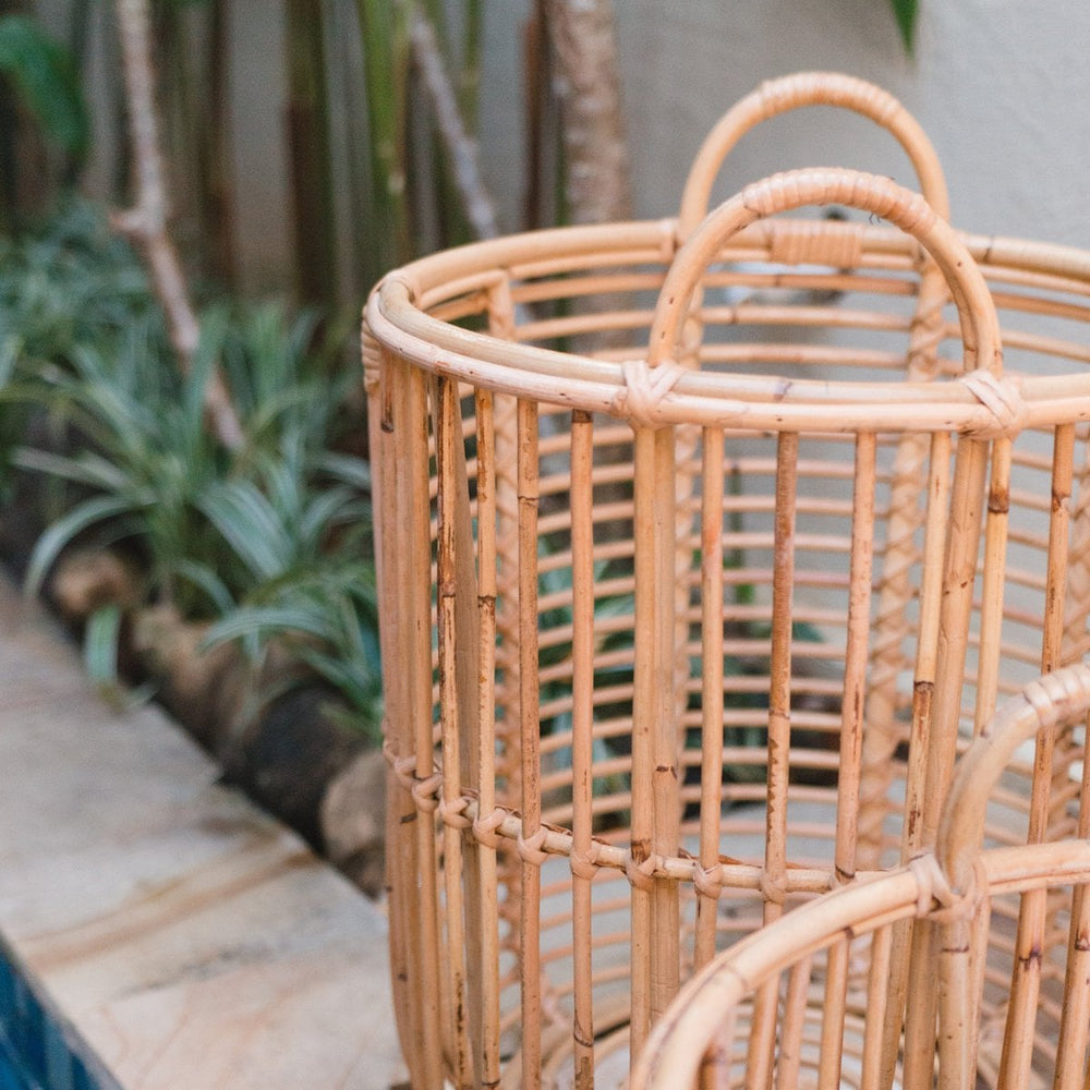 Beige woven rattan laundry basket with handles