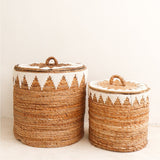 Brown woven banana fibre laundry basket with lid and white cotton macrame pattern