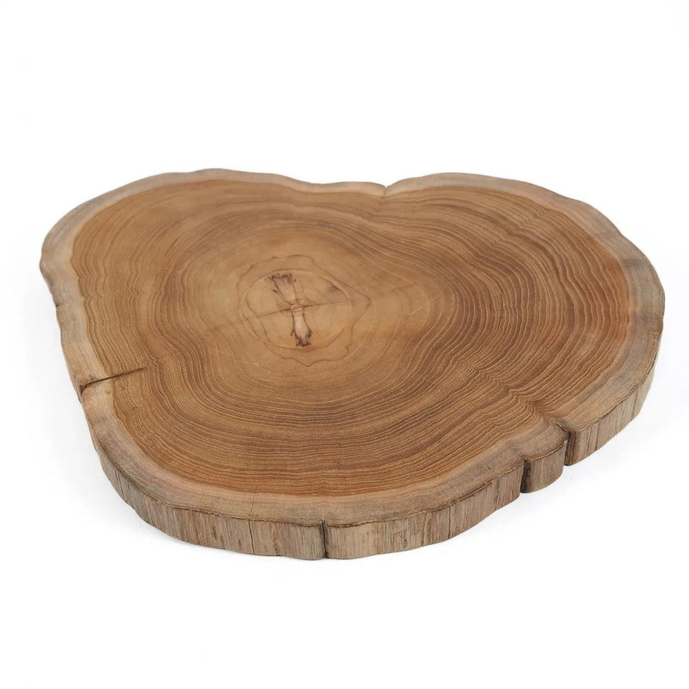 Brown teak wood cutting board with natural root shape