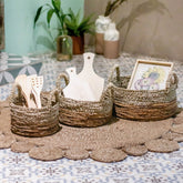 Beige and brown woven seagrass and banana fibre storage basket