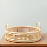 Beige round rattan serving tray