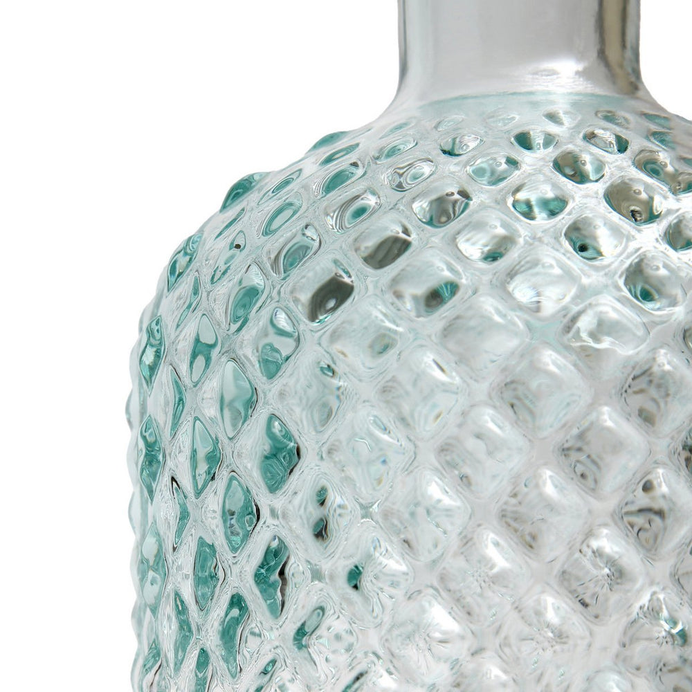 Blue textured glass bottle
