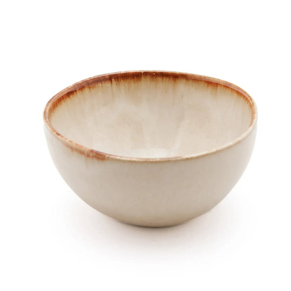 White stoneware cereal bowl with cinnamon-toned drip glaze