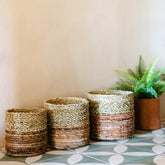 Two-tone brown and beige woven seagrass and banana fibre basket