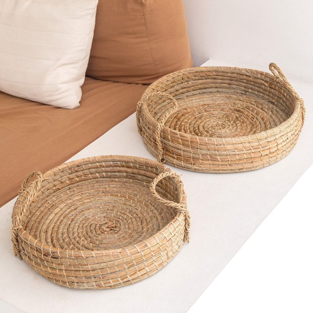 Beige woven seagrass round serving tray with handles
