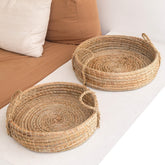 Beige woven seagrass round serving tray with handles