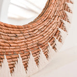 Round woven banana fibre wall mirror with white cotton pattern