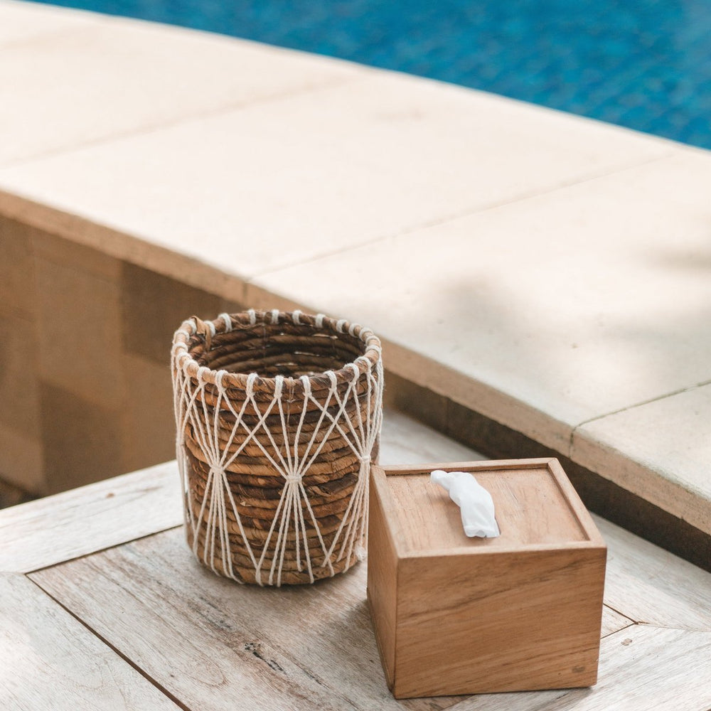 Brown and white woven banana fibre storage basket with cotton macramé lacing