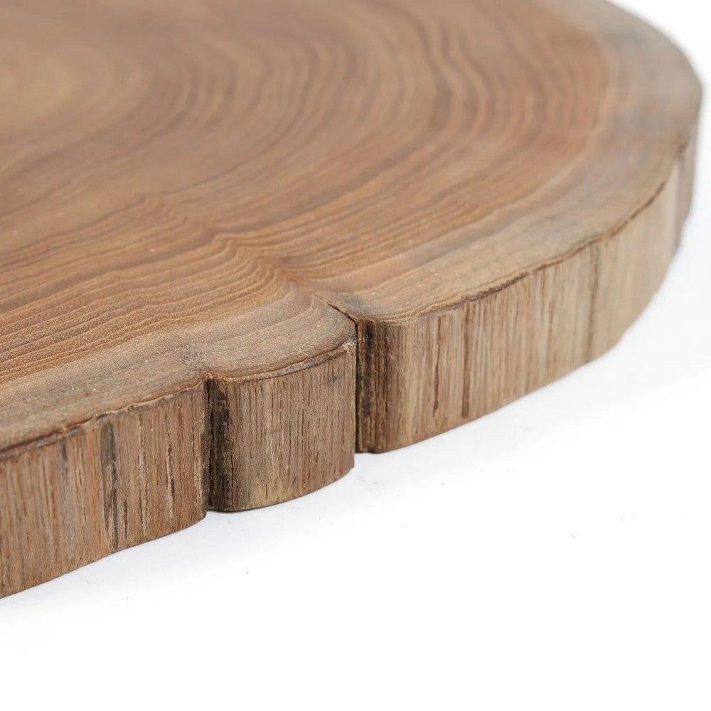 Brown teak wood cutting board with natural root shape