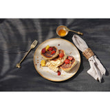 White stoneware dinner plate with burnt-umber rim