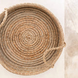 Beige woven seagrass round serving tray with handles