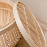 Beige bamboo basket side table