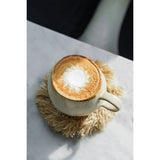 Natural raffia coaster with fringed edge