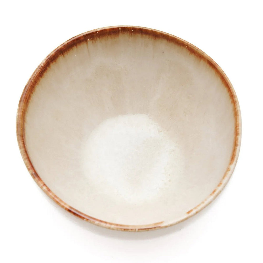 White stoneware cereal bowl with cinnamon-toned drip glaze