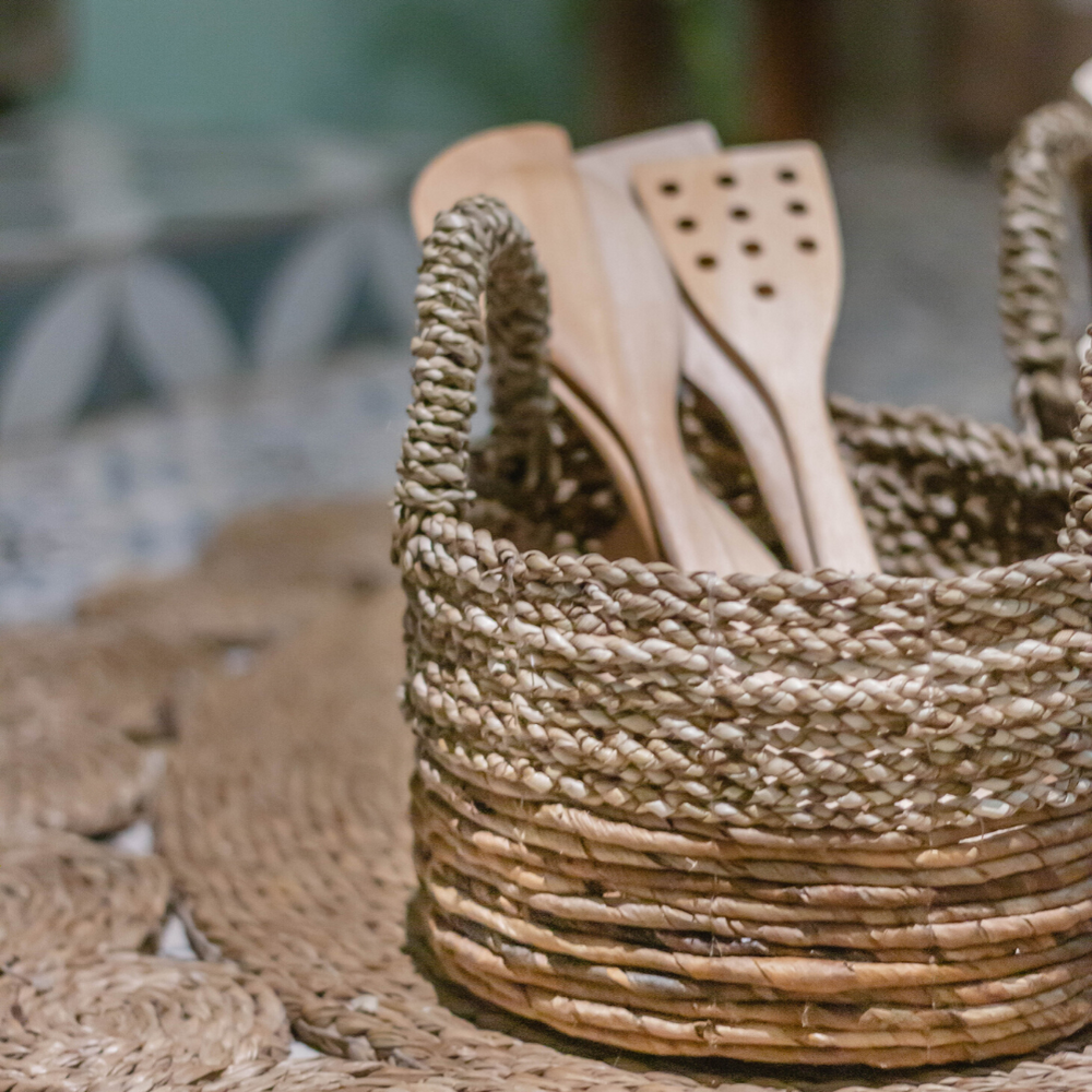 Beige and brown woven seagrass and banana fibre storage basket