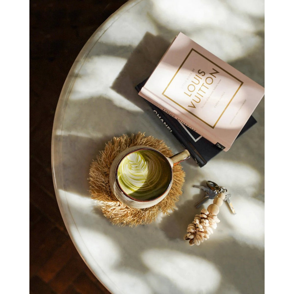 Natural raffia coaster with fringed edge