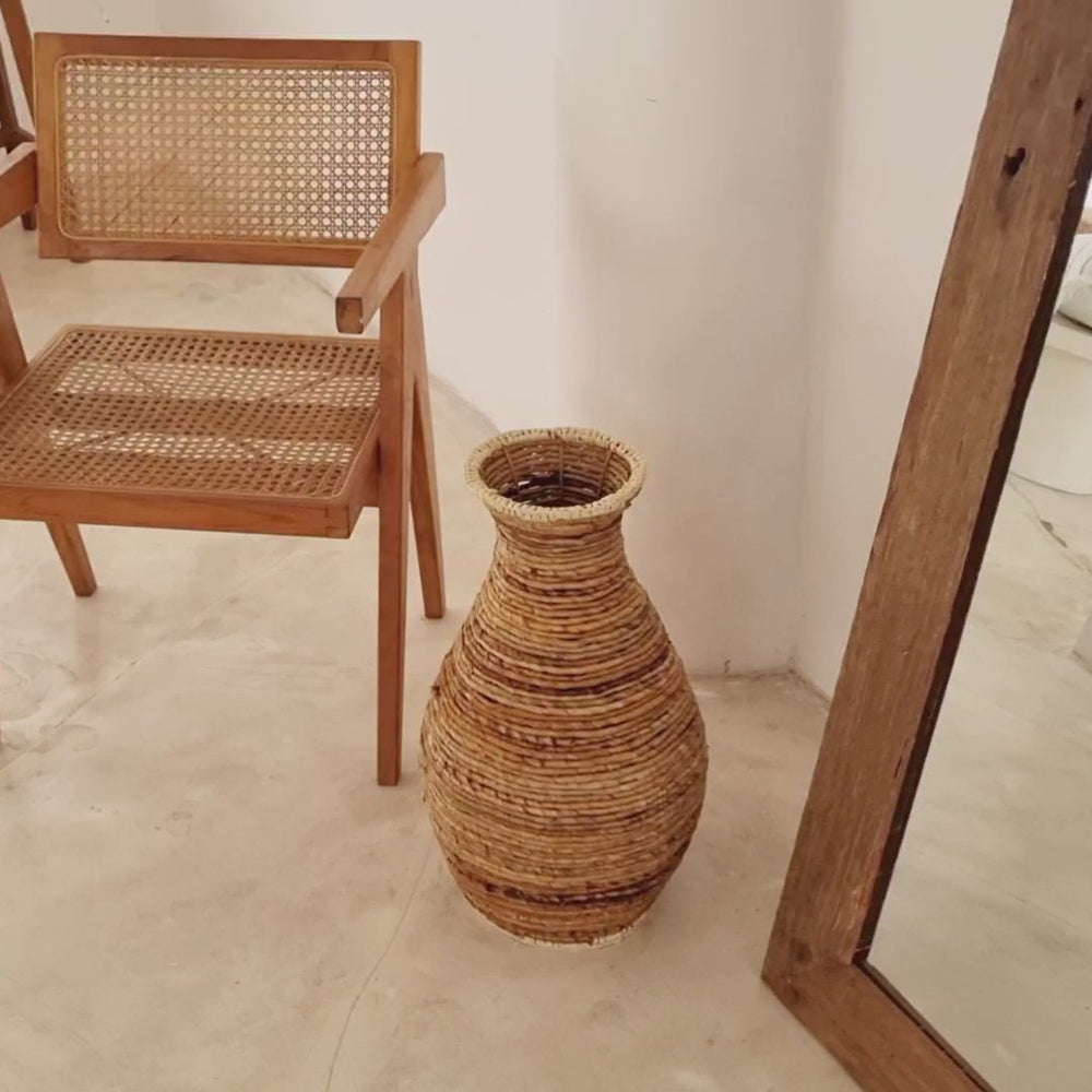 Beige and brown handwoven banana fiber vase with raffia accents