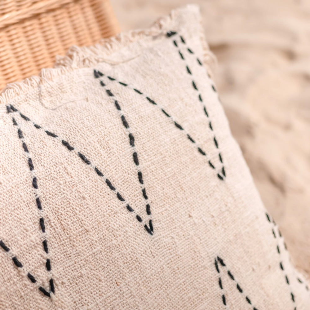 Black and white handwoven cotton cushion cover with zigzag pattern and fringes