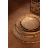 White stoneware dinner plate with burnt-umber rim
