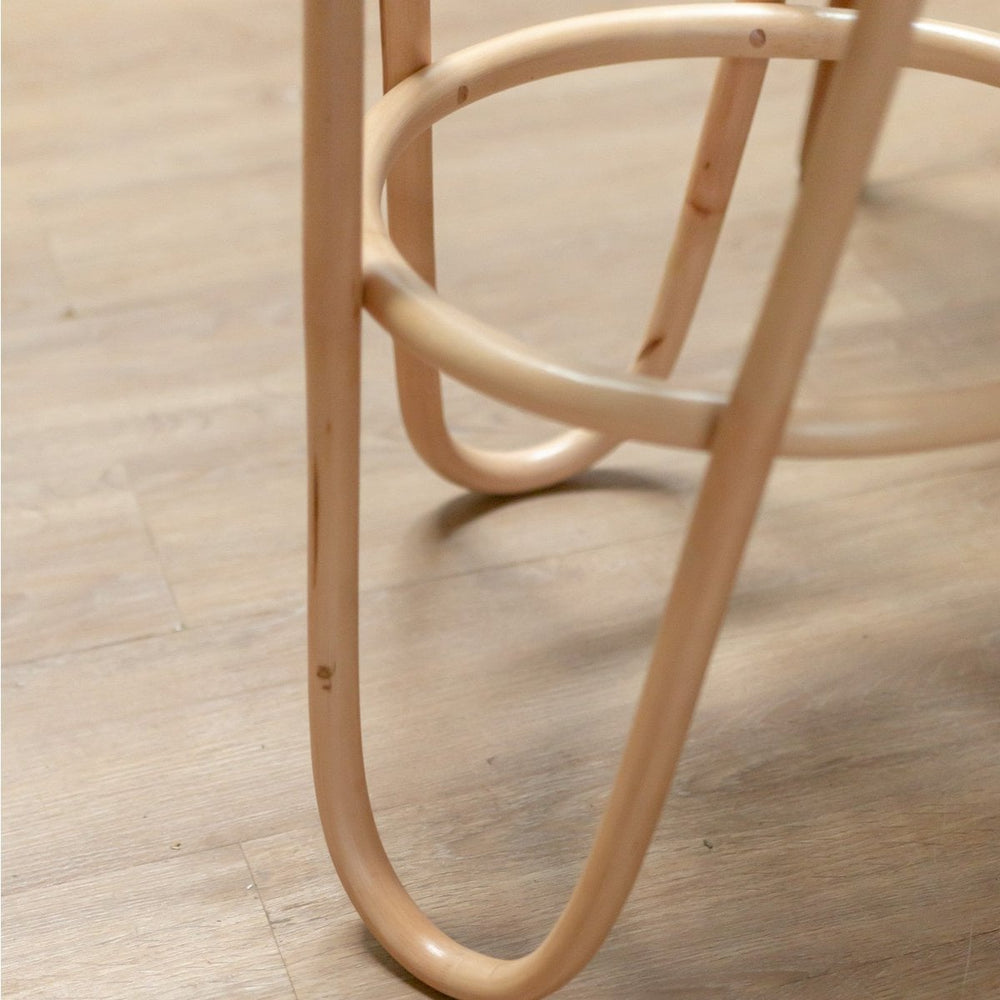 Natural rattan stool with woven seating surface