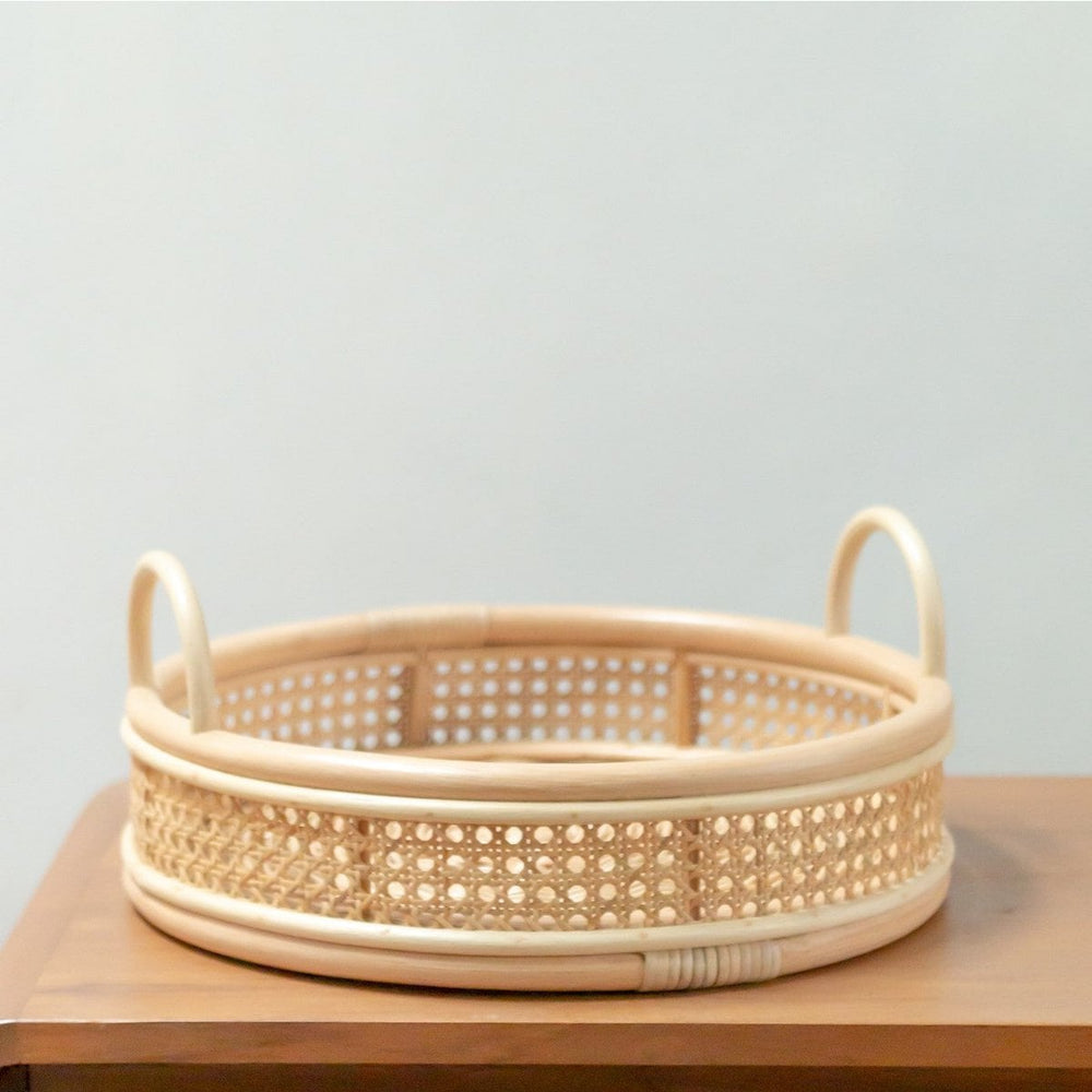 Beige round rattan serving tray