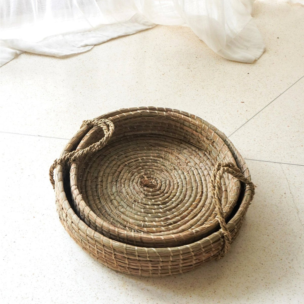 Beige woven seagrass round serving tray with handles