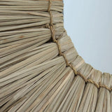 Beige round grass-framed mirror