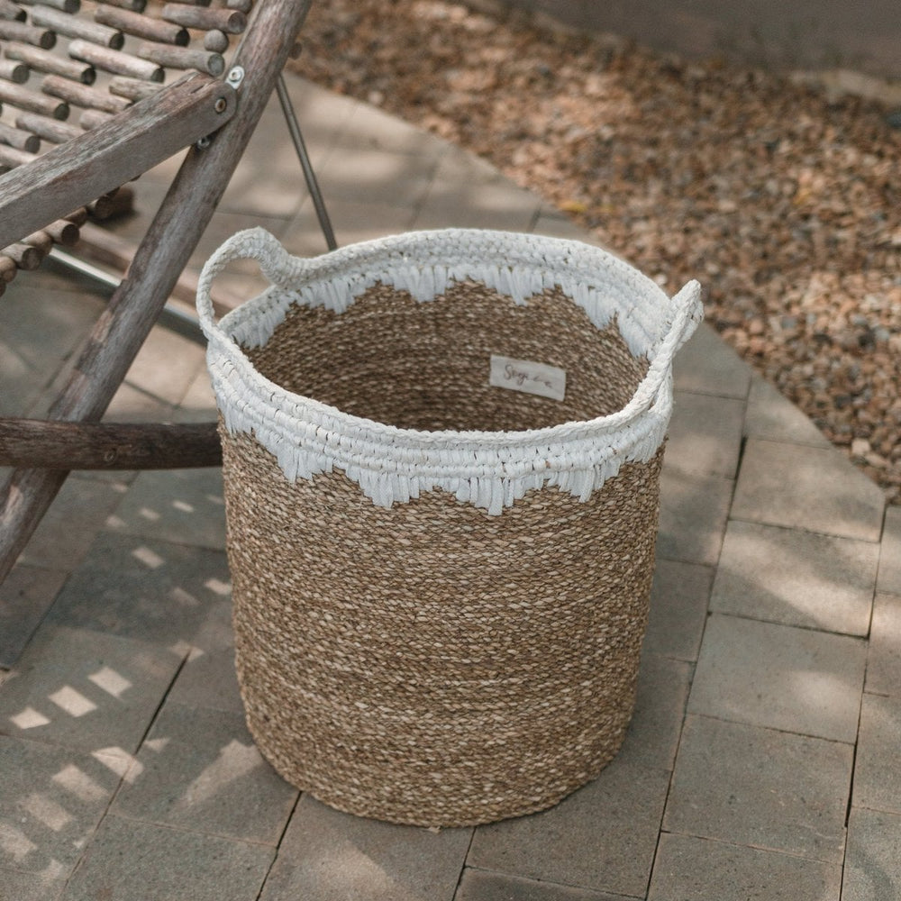 White woven seagrass storage basket with handles