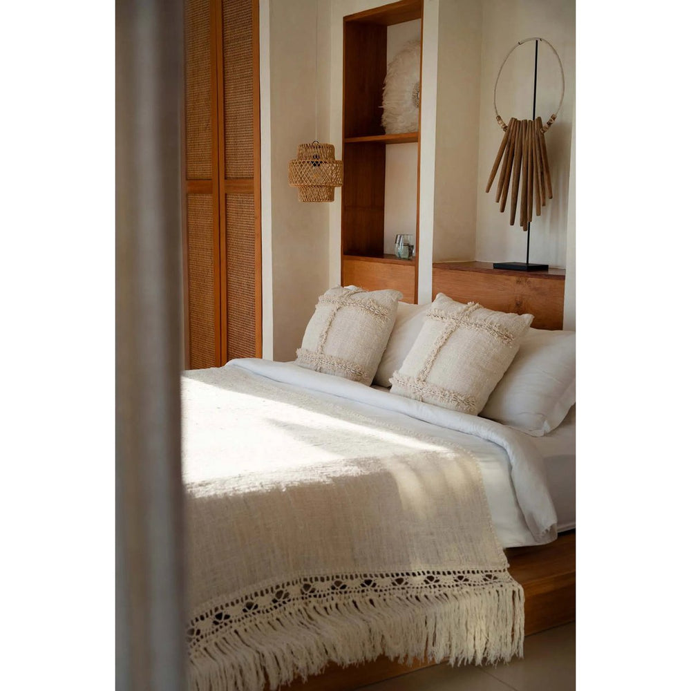 Natural cotton cushion cover with travel-inspired pattern