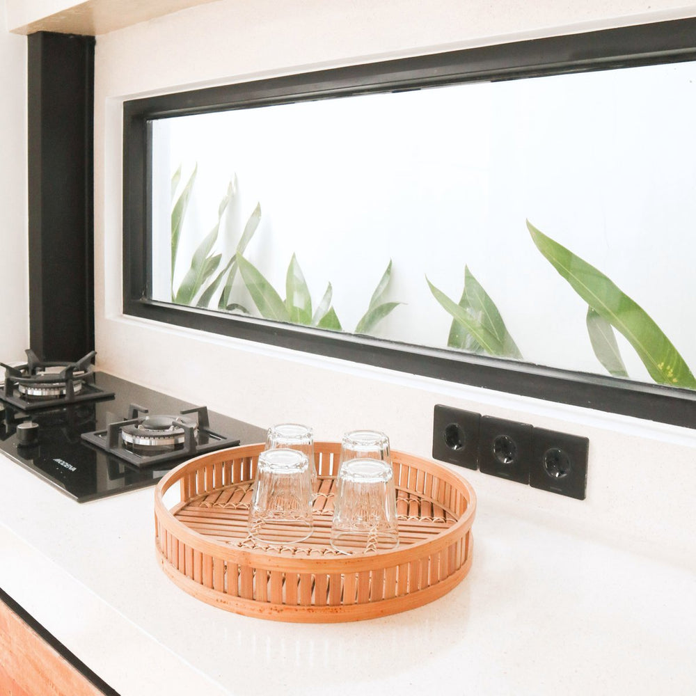 Beige round bamboo serving tray