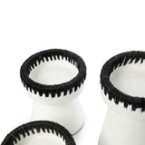 White and black terracotta candle holder with raffia trim