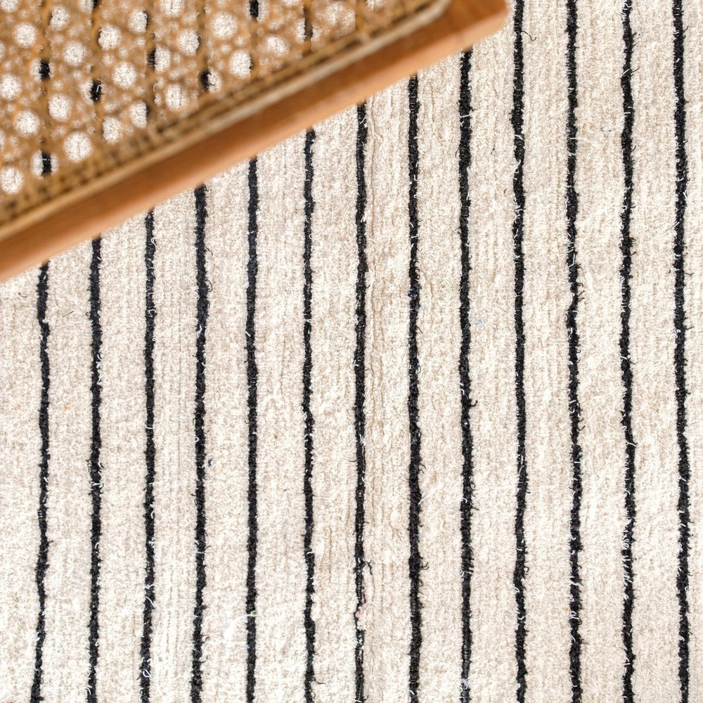 White handwoven cotton rug with black stripes