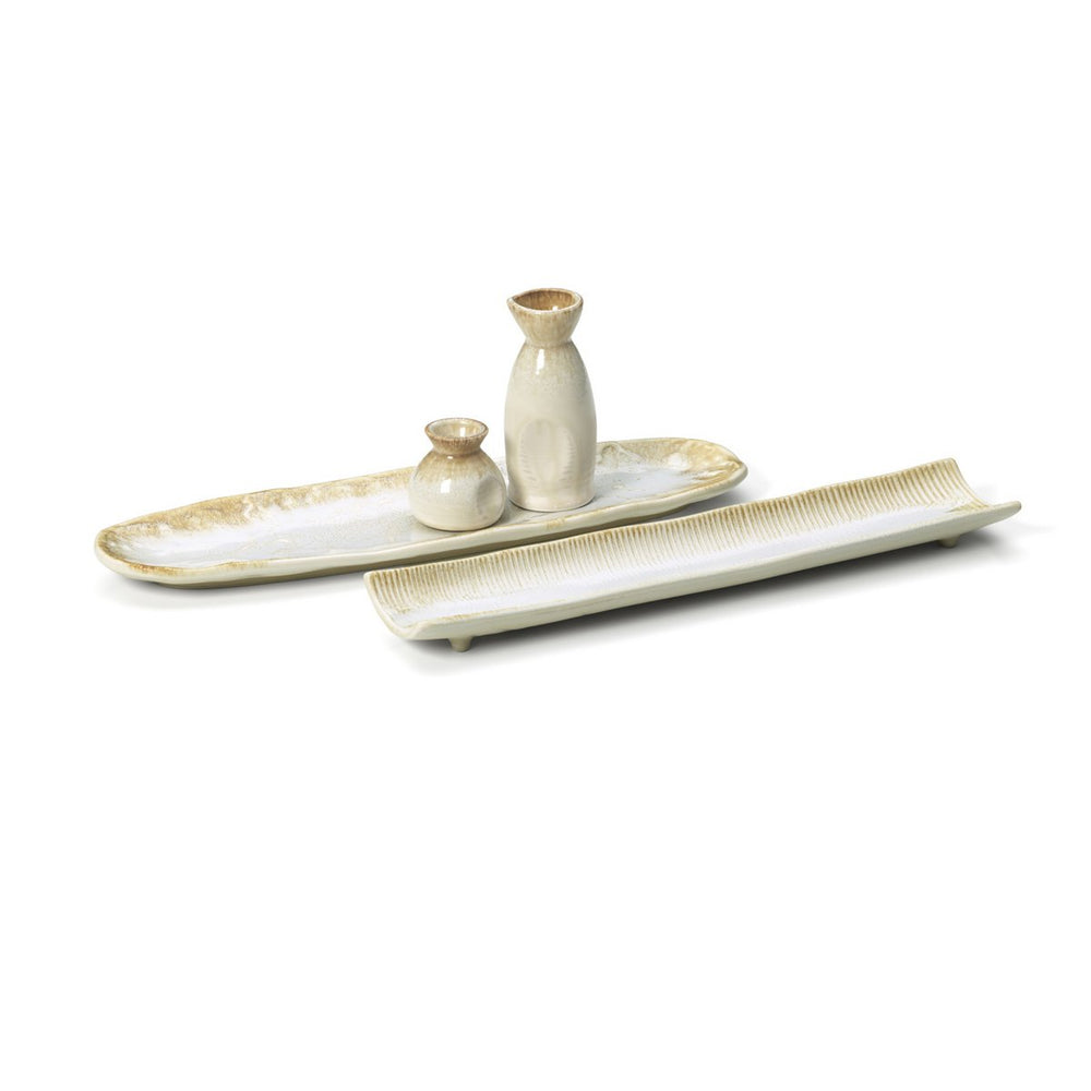 Beige ceramic sauce pourer with white honey glaze