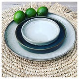 Natural raffia round placemat with fringe