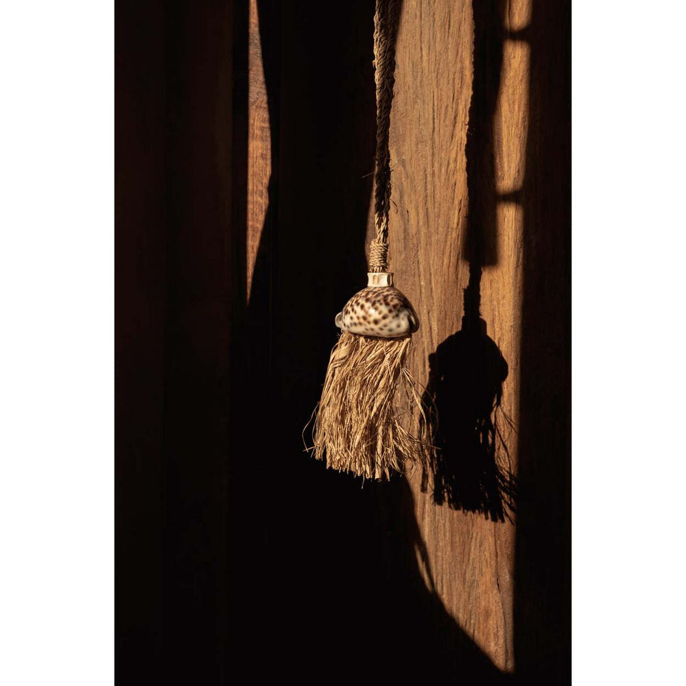 Natural raffia tassel with shell accent