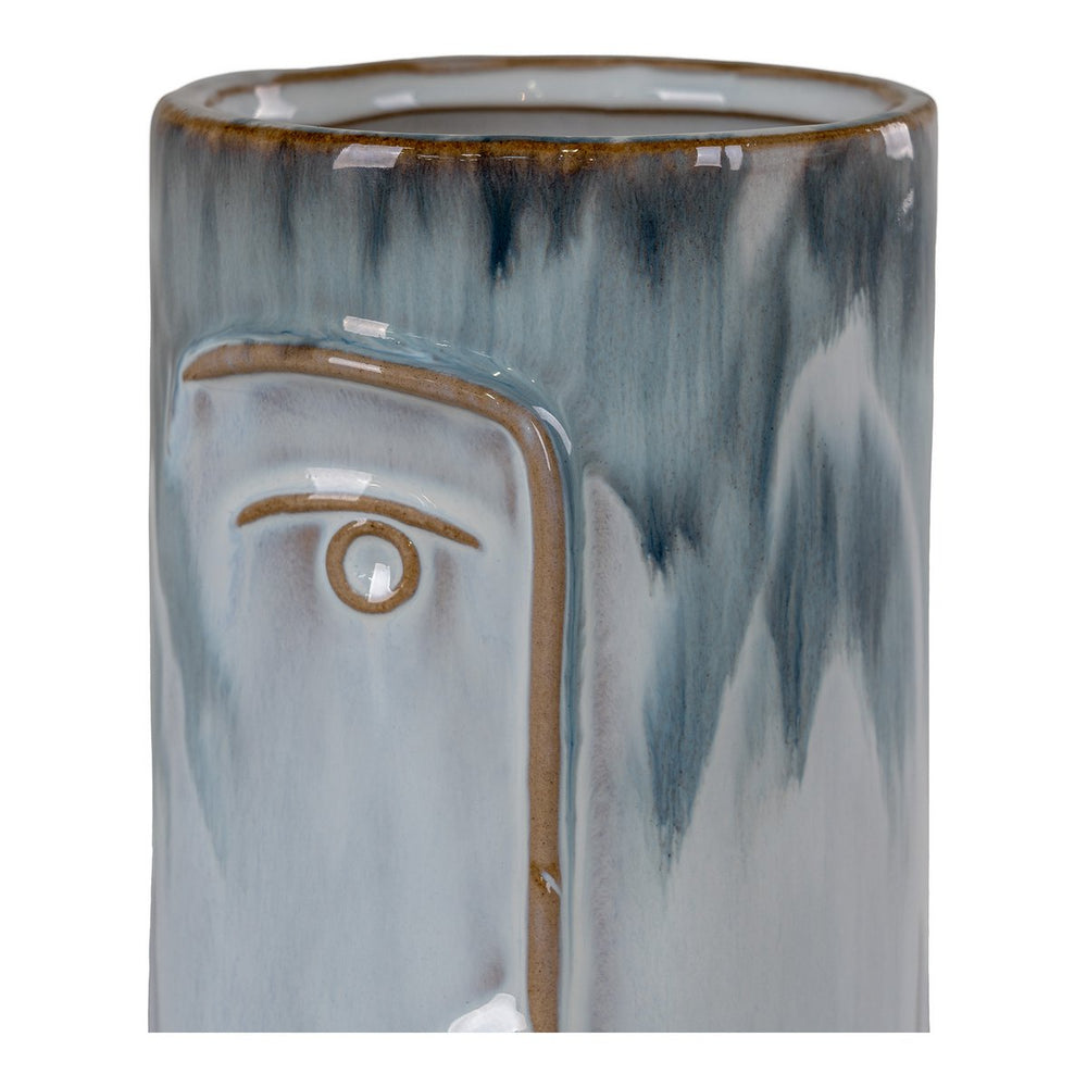 Blue porcelain vase with hand-painted face design