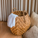 Beige and brown woven water hyacinth basket with zig zag pattern