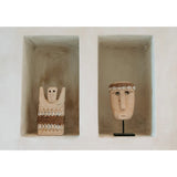 Sandstone statue with cowrie shells and jute wrap
