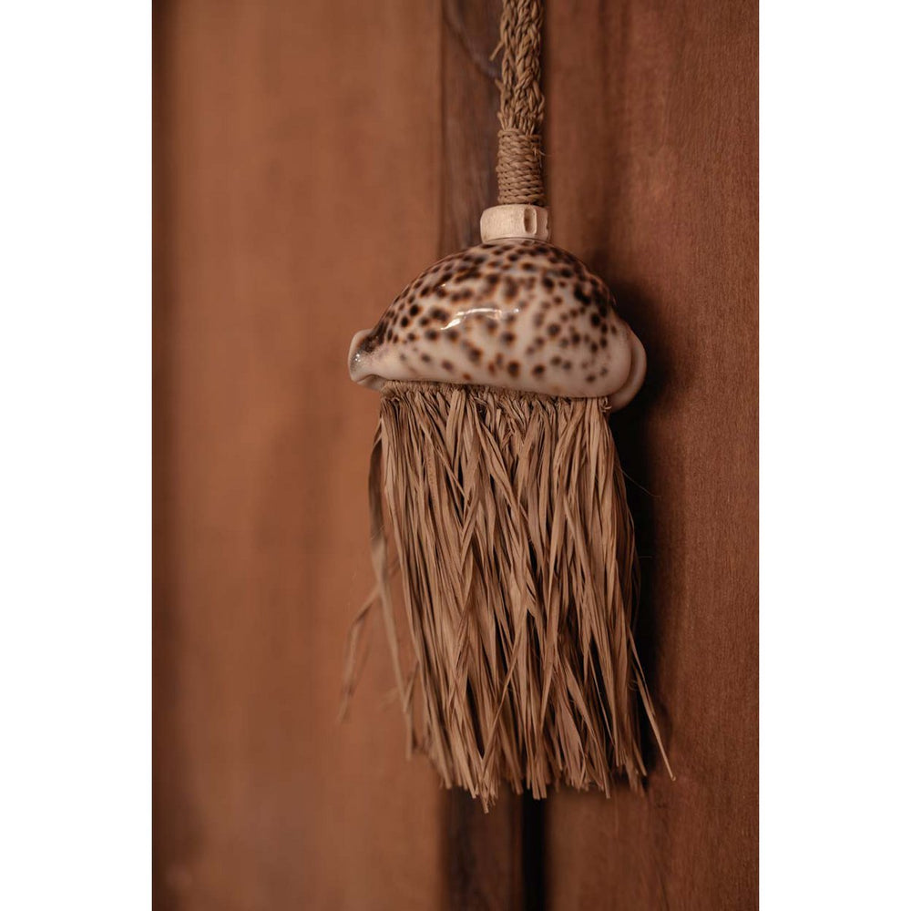 Natural raffia tassel with shell accent