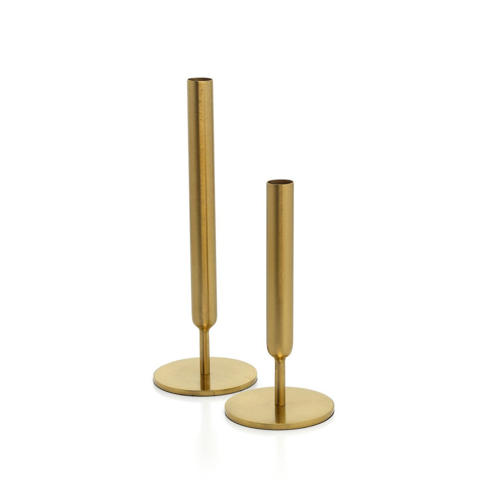 Two gold candle holders on a white background